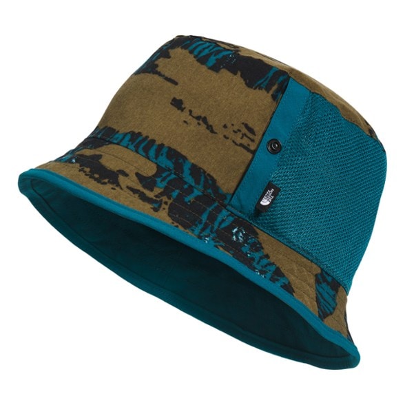 The North Face Packable Reversible Bucket Hat displayed outdoors with a scenic background.