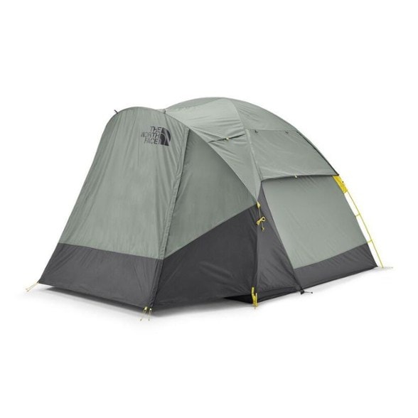 Wawona 4P tent setup in a lush green campsite, showcasing its spacious vestibule and double-wall construction.