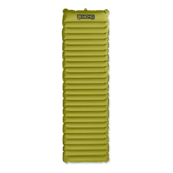 NEMO Astro insulated sleeping pad displayed at a campsite, highlighting its thickness and lateral baffles.