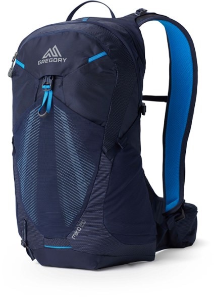 Side profile of the Gregory Miko 20 Plus hiking backpack worn by a plus-size hiker on a mountain trail