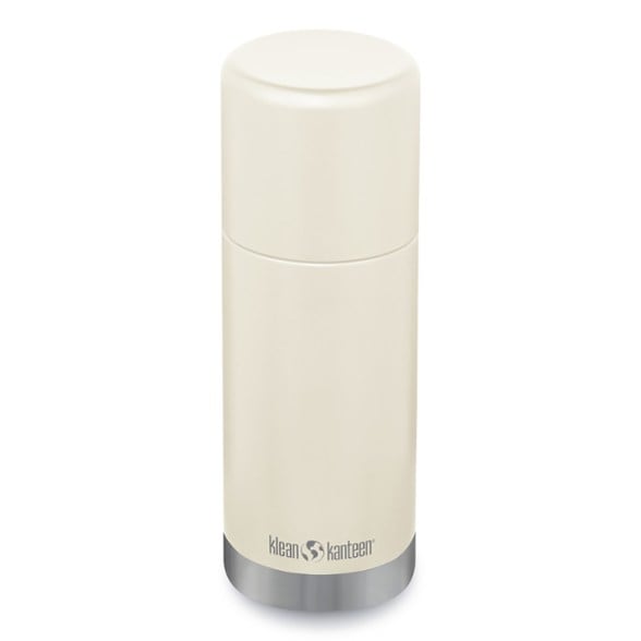 Klean Kanteen Eco Insulated Vacuum Bottle in a camping setting, showcasing its 360° pour-through lid.