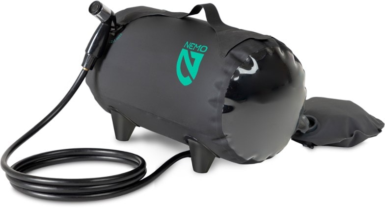 NEMO Helio Portable Pressure Shower in a campsite setting featuring its compact design.