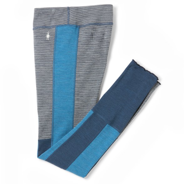 Women's base layer bottoms in motion – side view showing lettuce hem and fitted silhouette