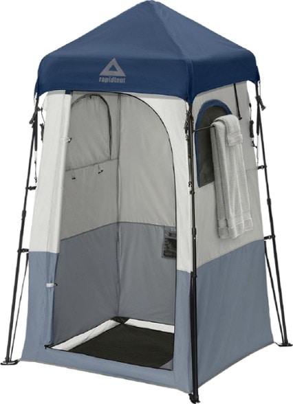 Outdoor privacy tent for beach setup, showing mesh roof and zip-up windows.