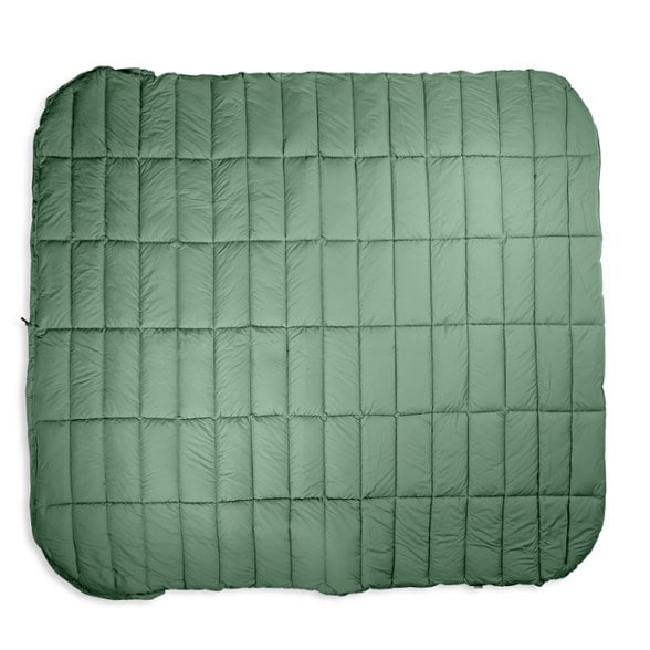 EcoPack Comforter in a scenic camping setting, showcasing its soft fabric and adjustable footbox.