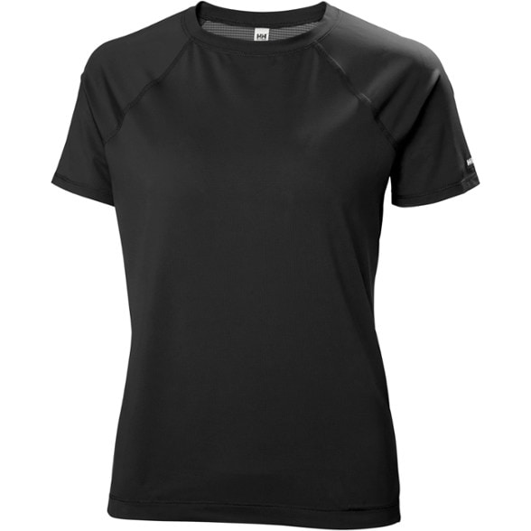 Trailblazer Women's Performance Tee in vibrant color, shown on a hiking trail with lush greenery.