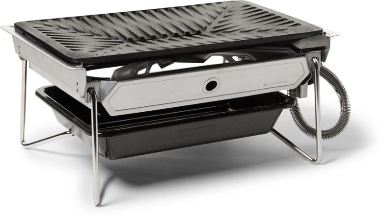 Snow Peak grill burner view from the front, showing its cast iron surface.