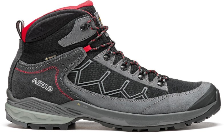 Close-up of Falcon EVO GV Men's Hiking Boots in a rugged outdoor setting, highlighting waterproof features.