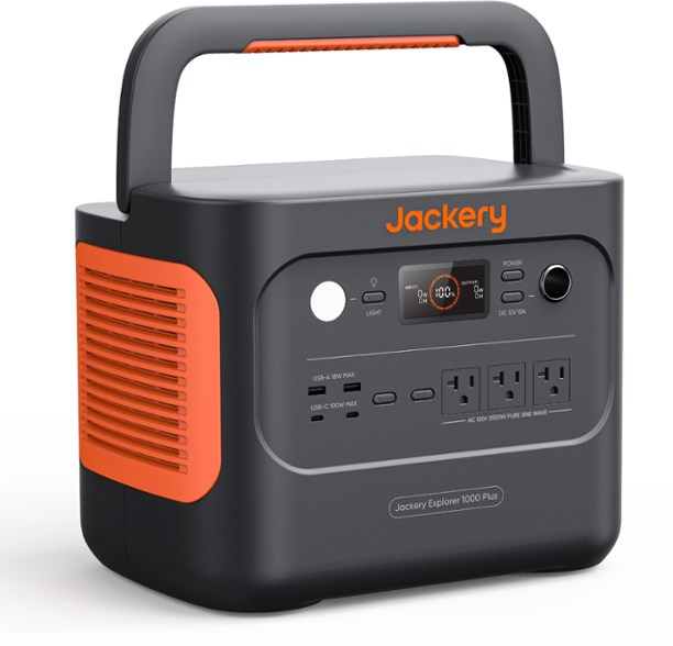 Jackery Explorer 1000 Plus Portable Power Station at a campsite with solar panels.