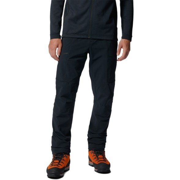 Men's Chockstone Alpine climbing pants in action on a rocky trail