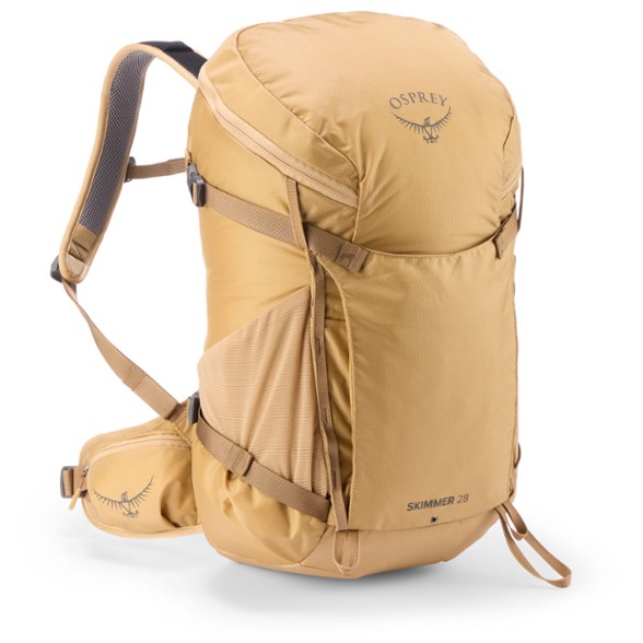 Osprey Skimmer 28 hydration pack in action on a hiking trail, showcasing its ergonomic design and hydration features.