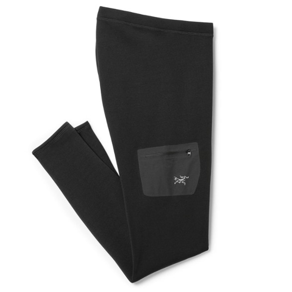 Rho Heavyweight Base Layer Bottoms displayed on a model in a snowy landscape, demonstrating warmth and flexibility.