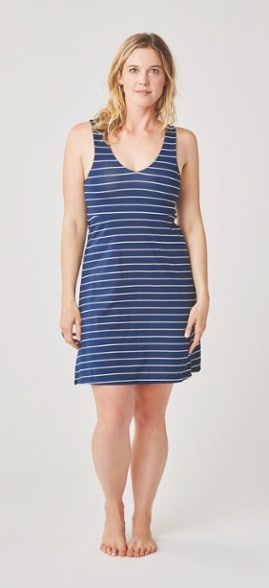 Front view of the Lyla Breeze summer dress in motion during a beach walk