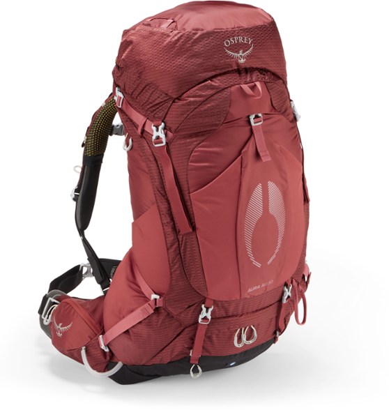 Osprey Aura AG 50 hiking backpack showcased in a forest setting, highlighting its lightweight design.