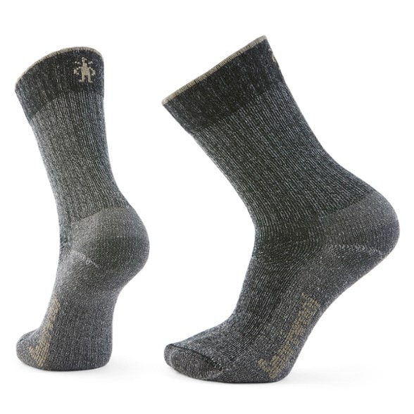 Eco-friendly merino wool hiking socks displayed outdoors on a rocky trail.