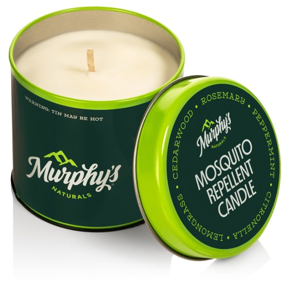Murphy's Naturals mosquito repellent candle in a cozy outdoor setting, showcasing its fresh citrusy color and design.