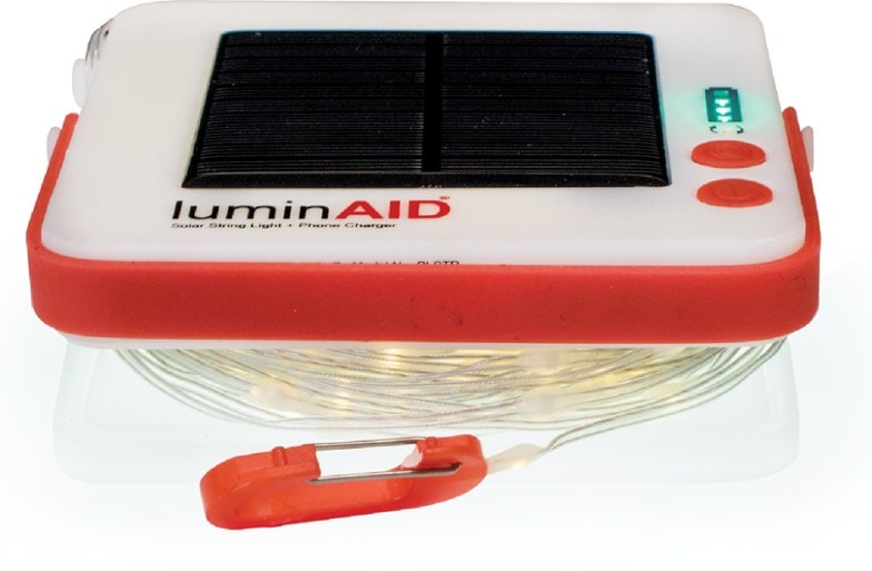 Close-up of LumiTrail solar string lights glowing at dusk in a camping setup