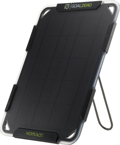 NomadLite 5W monocrystalline solar panel angled with kickstand for optimal sunlight capture during camping