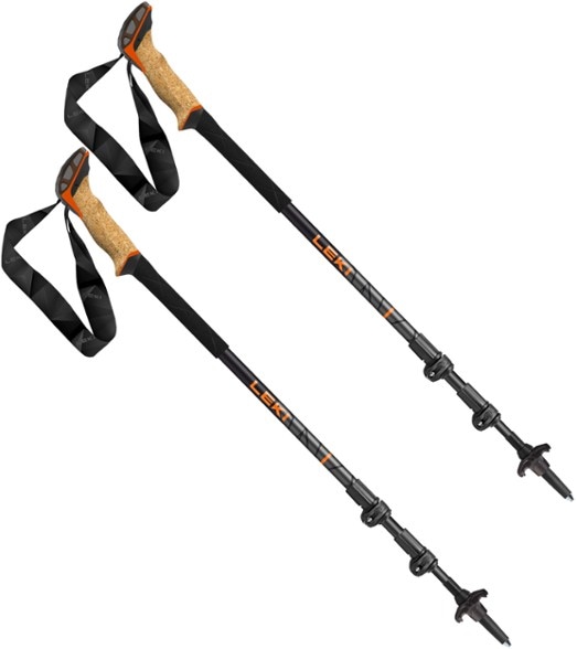 Angled front view of SummitCork Pro trekking poles with cork grips and Speed Lock+ mechanism shown on a grassy trail