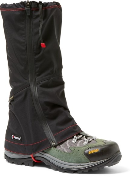 Eco-friendly tall GORE-TEX gaiters in action on a muddy trail, showcasing waterproof features.