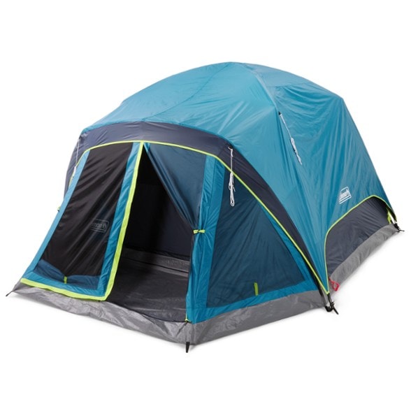 Coleman Skydome 6-Person Dark Room tent in a picturesque campsite with a forest background.