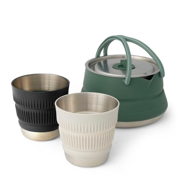 SummitNest™ collapsible camp kettle expanded and filled with hot water outdoors