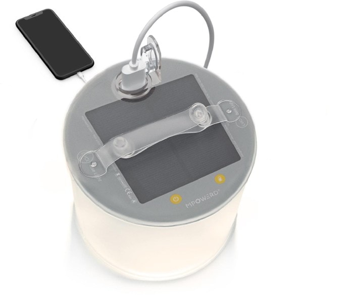 Front view of the inflatable lantern fully expanded on a campsite table