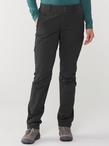 Front view of REI Co-op Activator soft-shell pants for women, showing breathable fabric and zipper pockets