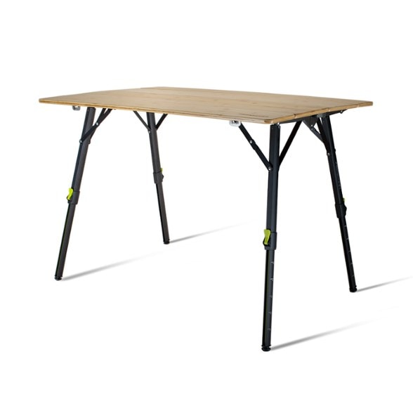 Kitpac Pro XL camping table set up for outdoor dining with food prep items on top.