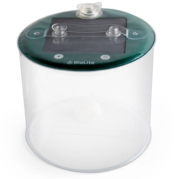 Luci Charge 150 solar lantern illuminated in a campsite setting during nighttime.