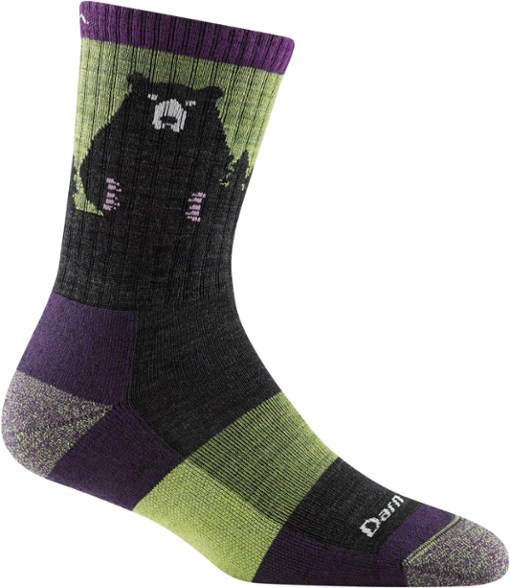 TrailBliss merino wool crew socks displayed on a rock during a hike, showcasing their lightweight design.