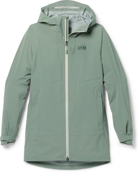XeroCloud Women's 3L Long Waterproof Rain Jacket showcasing its waterproof features on a hiking trail.