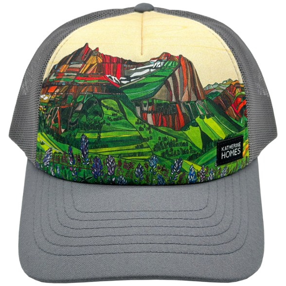 Katherine Homes trucker hat in outdoor setting, showcasing breathable design and mesh back for sun protection.
