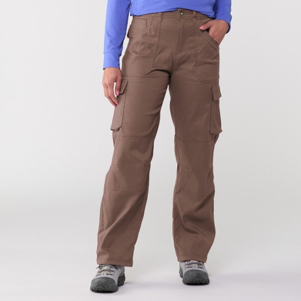 Ultimate Women's Stretch Cargo Pants displayed on a hiking trail, highlighting their relaxed fit and pockets.