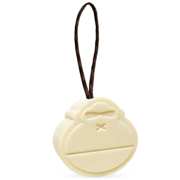 Adventure soap on a rope hanging from an outdoor shower, perfect for camping trips.