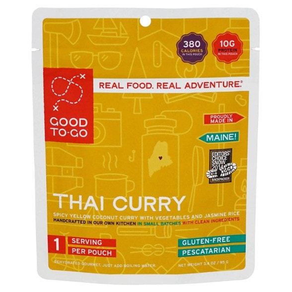 Spicy Thai coconut curry served in a camping bowl, showcasing vibrant colors and textures.