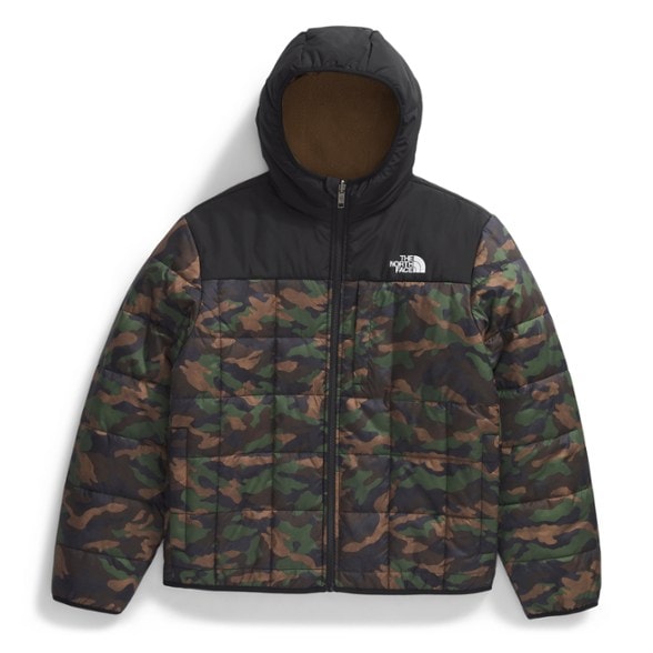 Front view of Shasta reversible jacket boys wearing hood up in snowy weather, showcasing full zip hooded boys winter jacket design