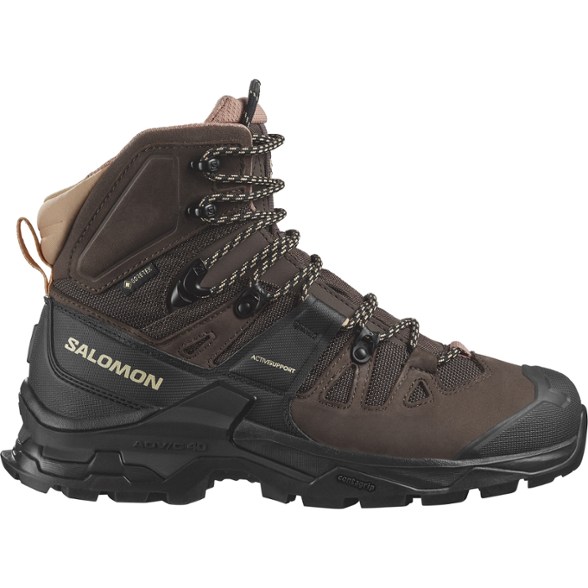 Salomon Quest 4 women's GORE-TEX hiking boots showcasing rugged design and grip on rocky terrain.