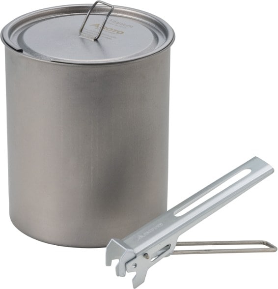 Soto titanium pot on a camping stove with water boiling, showcasing its ultralight design.