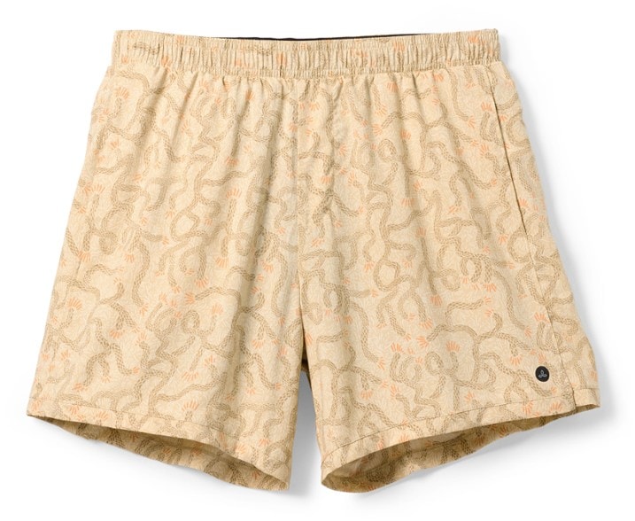 Trailblazer men's hiking shorts on a rocky trail with a scenic background.