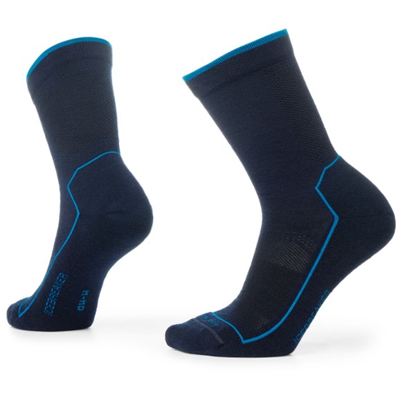 Men's merino wool ultralight hiking crew socks in action on a sunny trail.