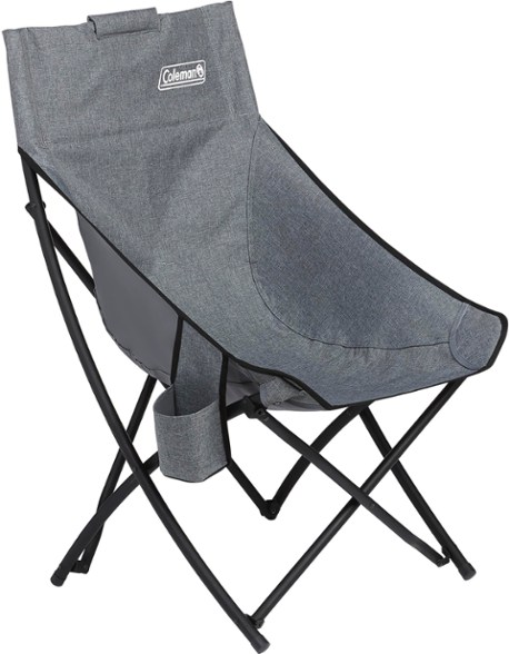 Coleman Forester bucket chair with cup holder, set up in a backyard