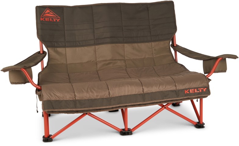Kelty CozyNest Camping Loveseat with blankets and insulated cup holders by the campfire.