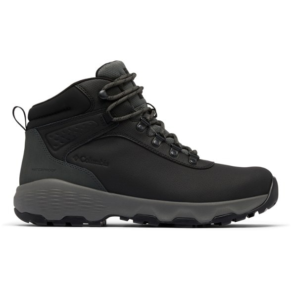 Columbia Men's Newton Wander hiking boots in rugged terrain, highlighting waterproof leather and traction soles.