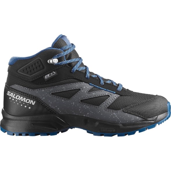 Salomon Kids' Adventure Mid Waterproof Hiking Boots displayed on rocky terrain.