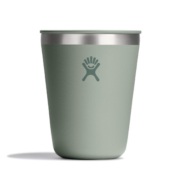 Hydro Flask insulated tumbler in a camping setting, filled with hot cocoa.