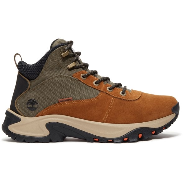 Side view of Timberland Mt. Maddsen Peak Mid Waterproof Hiking Boots for men on a rocky trail.