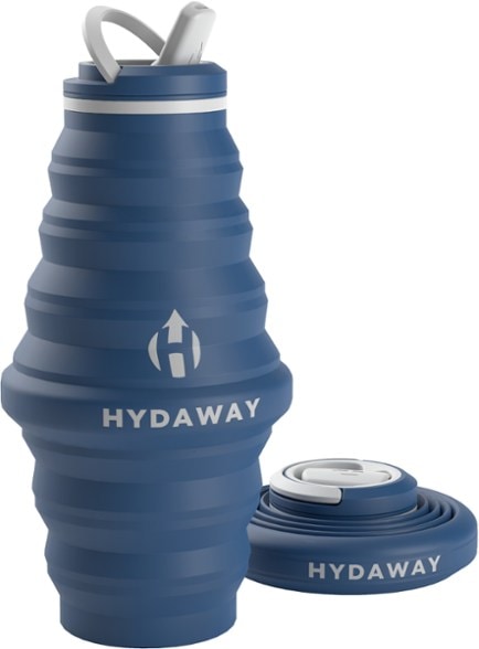Hydaway 25 oz collapsible water bottle in a backpack during a hike, demonstrating its portability.