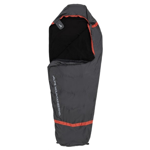 Versatile mummy sleeping bag liner displayed outdoors, showcasing its soft fleece interior.