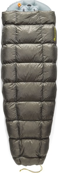 EmberLite 30F down quilt spread out on a sleeping pad, showcasing lightweight backpacking gear